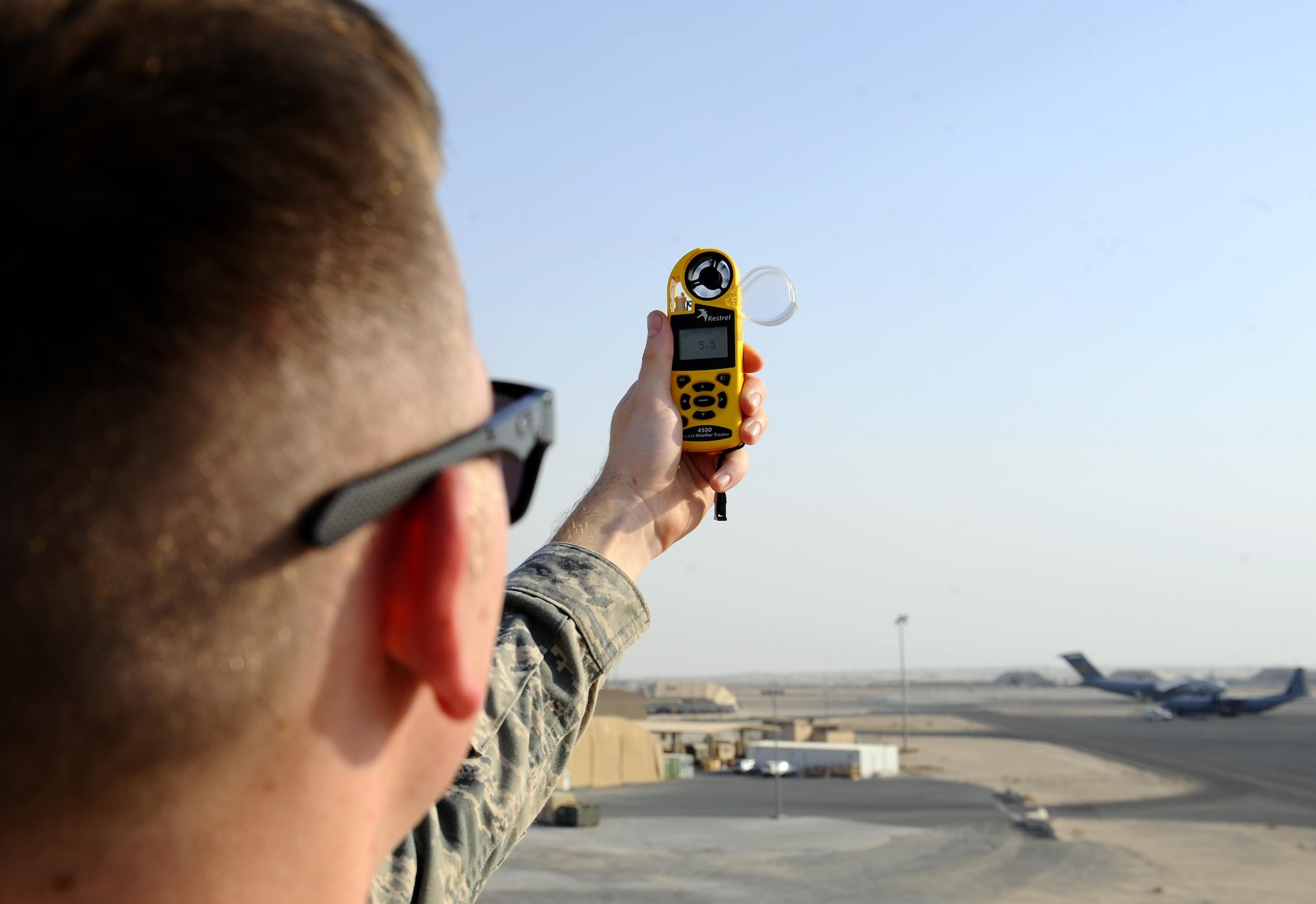 U.S. Air Force Senior Airman David Baily, 386th 386th Expeditionary Operations Support Squadron weather forecaster, uses a hand-held wind meter to determine wind gusts at an undisclosed location in Southwest Asia, Oct. 16, 2015. Air Force weather forecasters rely on traditional observation techniques to provide accurate weather intelligence for aircraft flying missions in support of Operation INHERENT RESOLVE. (U.S. Air Force photo by Staff Sgt. Tyler Alexander/Released)