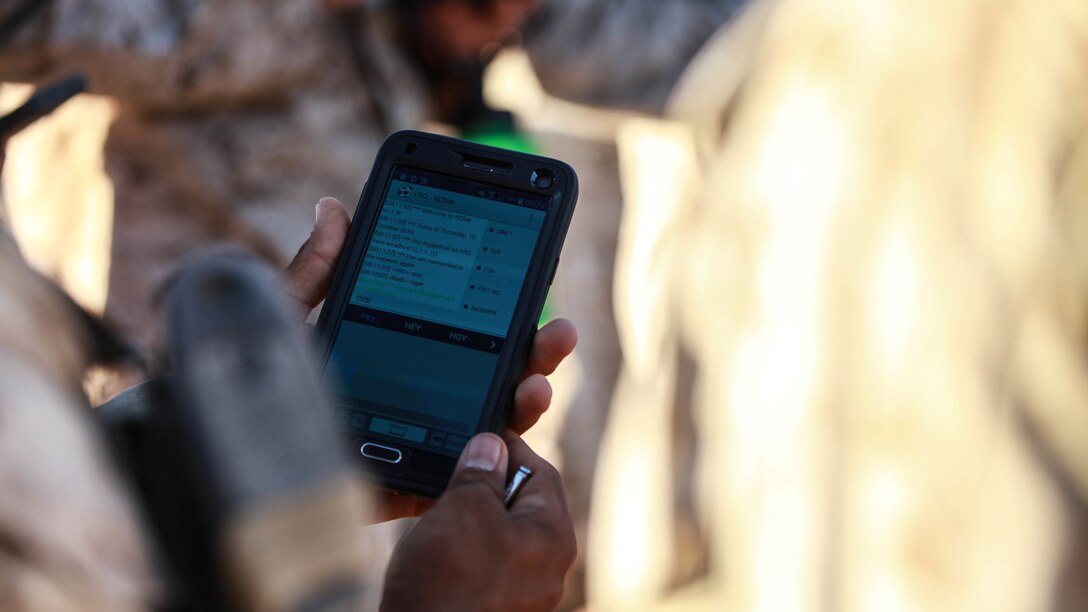 A Marine with Fox Company, 2nd Battalion, 7th Marine Regiment tests out the instant messaging function on a tablet device at Marine Corps Air Station Yuma, Arizona, Oct. 14, 2015. The tablets are wirelessly connected through an encrypted internal Wi-Fi network allowing Marines to coordinate and maneuver more efficiently in a tactical environment while securely using various applications on the devices.