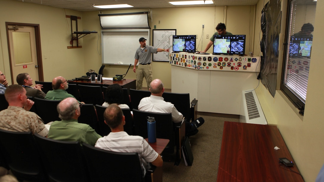 Employees of Kranze Technology Solutions explain the Kinetic Integrated Low-cost Software Integrated Tactical Combat Handheld application to participants at the Mobility Joint Capability Technology Demonstration at Marine Corps Air Station Yuma, Arizona, Oct. 15, 2015. KILSWITCH is an application on tablets that the Marine Corps is using. The application gives Marines real-time situational awareness by using a map similar to Google maps but without having to be connected to a server.