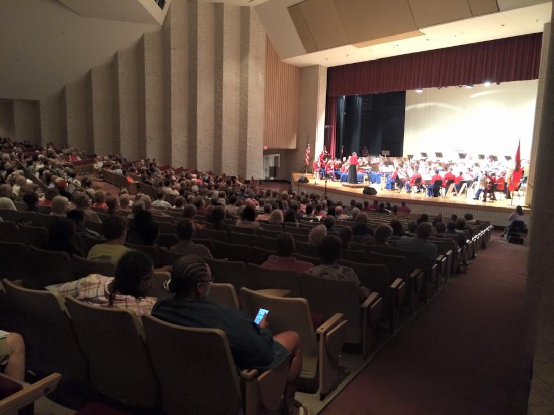 Musicians with the “The President’s Own” Marine Corps Band stun the crowd with their performance at the Woodrow Wilson High School auditorium Sept. 16, 2015, in Beckley, West Virginia. The band's mission is to perform for the President of the United States and the Commandant of the Marine Corps, but is celebrated for its role at the White House and its annual schedule of more than 500 dynamic public performances. (U.S. Marine Corps photo by Sgt. Caitlin Brink/Released)