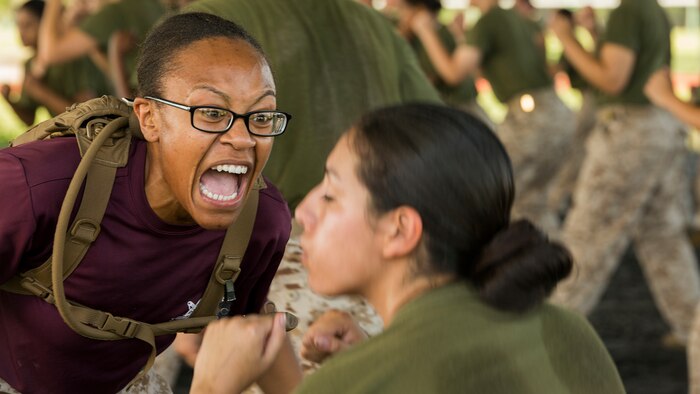 Sgt. Yonique R. Cousins, Platoon 4026, Oscar Company, 4th Recruit Training Battalion, encourages a recruit to move faster during martial arts training June 16, 2015, at Marine Corps Recruit Depot Parris Island, S.C. The Marine Corps Martial Arts Program is designed to increase the warfighting capabilities of individual Marines and units, enhance Marines’ self-confidence and esprit de corps and foster the warrior ethos in all Marines. 