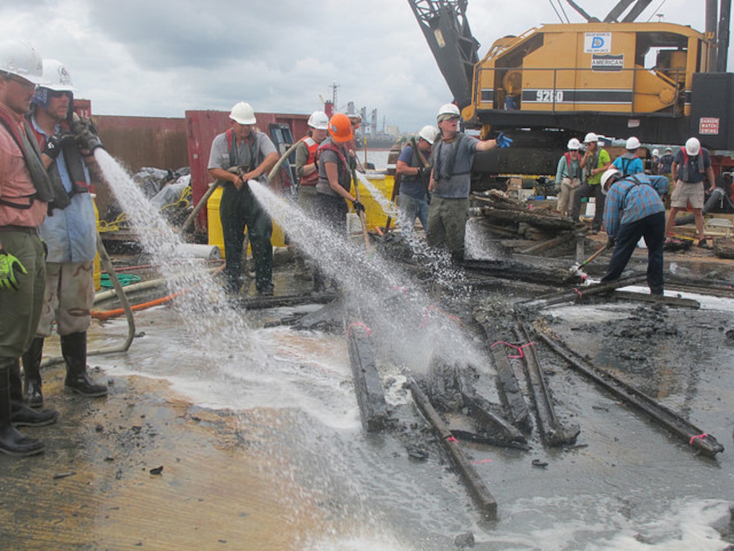 Archaeologists with Panamerican Consultants, Inc. spray down pieces of the CSS Georgia’s armor or “casemate” during the mechanized recovery phase, Sept. 24. The mechanized recovery is one of the final phases of the project that will remove the ironclad before deepening the Savannah harbor. 