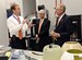 Martin Williams, the 76th Commodities Maintenance Group engineering branch chief, shows parts made using 3-D printing technology in the reverse engineering and critical tooling cell to Dr. Charles Bunting, associate dean of Research and Sponsored Programs at Oklahoma State University, and Dr. Burns Hargis, OSU president, during a tour of OC-ALC engineering and software facilities Oct. 7, 2015. (Air Force photo/Kelly White)