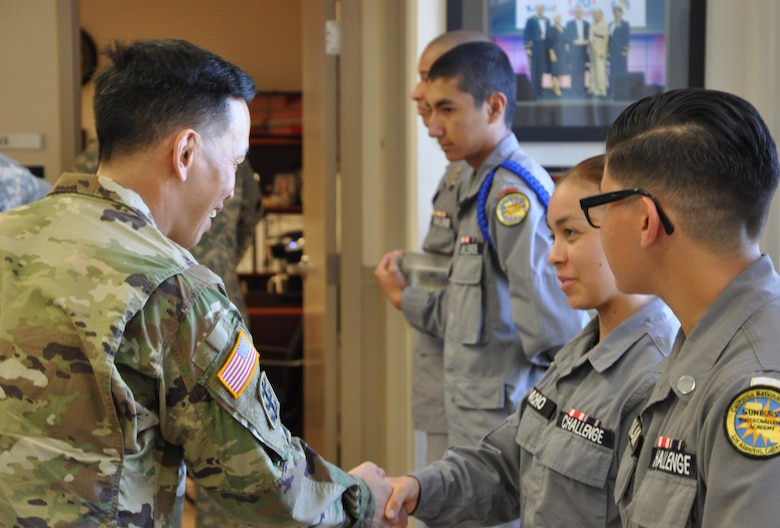 Brig. Gen. Mark Toy, USACE South Pacific Division commander greets Cadet Aylin Camacho as Cadets Stephanie Molina, Reise Rodriguez and Dantayan Mitchell look on during his visit to Los Alamitos Joint Forces Training Base.