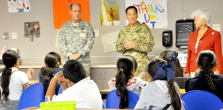 Brig. Gen. (CA) James Gabrielli, Youth and Community Programs Task Force commander; Brig. Gen. Mark Toy, USACE South Pacific Division commander and Rep. Grace Napolitano, D-Norwalk, talks to a local fifth grade class learning in the Science and Technology Academics Reinforcing Basic Aviation and Space Exploration Learning Center at Los Alamitos Joint Forces Training Base.