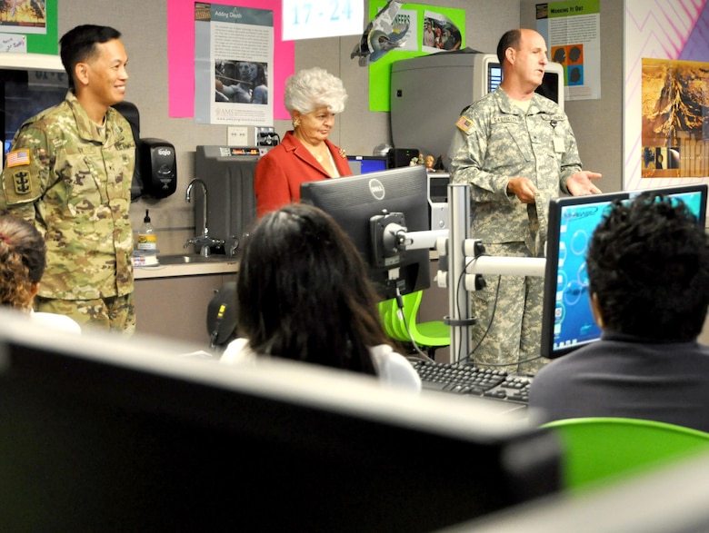 Brig. Gen. (CA) James Gabrielli, Youth and Community Programs Task Force commander; Brig. Gen. Mark Toy, USACE South Pacific Division commander and Rep. Grace Napolitano, D-Norwalk, talks to a local fifth grade class learning in the Science and Technology Academics Reinforcing Basic Aviation and Space Exploration Learning Center at Los Alamitos Joint Forces Training Base.
