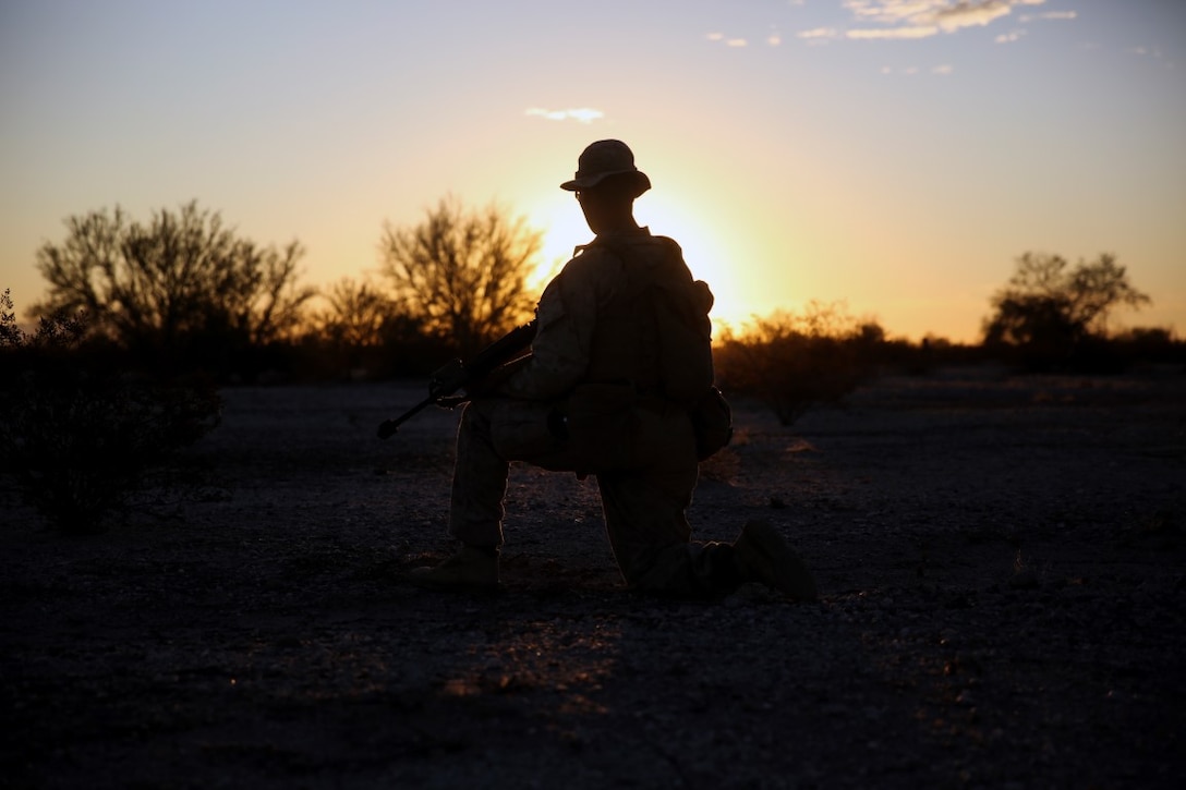 Lance Cpl. Paul Hameister, a rifleman assigned to Company E, 2nd Battalion, 7th Marine Regiment, 1st Marine Division, takes a knee during a patrol to survey the area during Talon Exercise 1-16 at Marine Corps Air Station, Yuma, Ariz., Oct. 14, 2015. The training took place at Baker’s Peak, a rugged desert training area located on the approximately 1,700,000 acre Barry M. Goldwater Range and was part of a larger event called Talon Exercise, which focused on offensive and defensive operations in desert and urban environments.