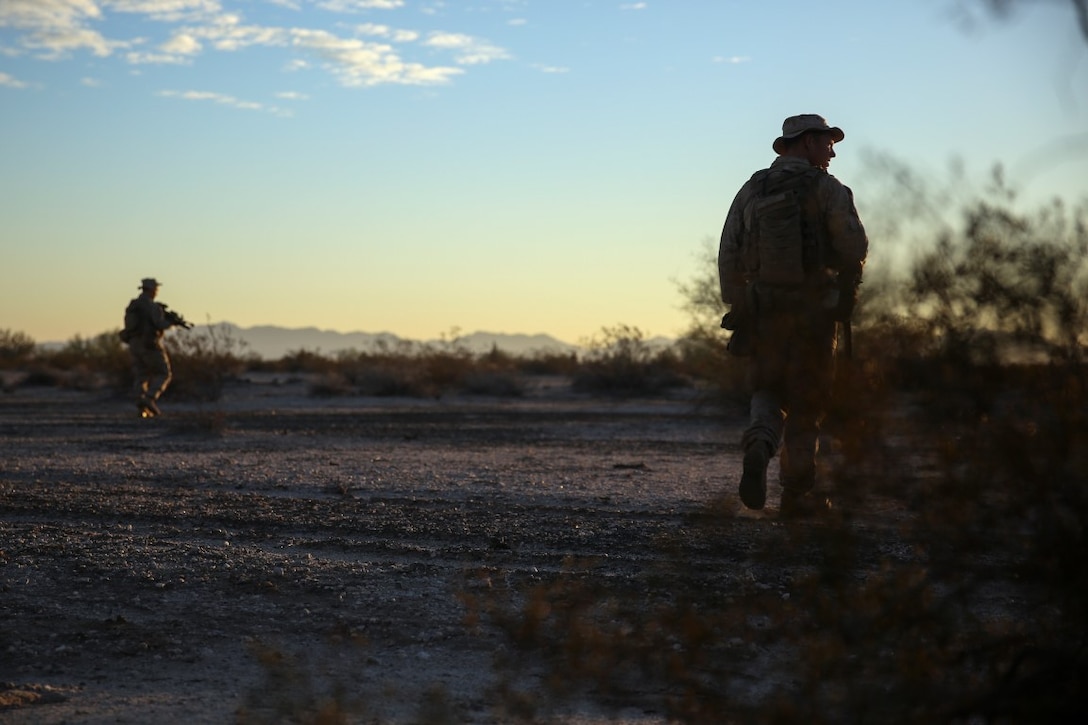 Marines assigned to Company E, 2nd Battalion, 7th Marine Regiment, 1st Marine Division, scan the area during a patrol as part of Talon Exercise 1-16 at Marine Corps Air Station, Yuma, Ariz., Oct. 14, 2015. The training took place at Baker’s Peak, a rugged desert training area located on the approximately 1,700,000 acre Barry M. Goldwater Range and was part of a larger event called Talon Exercise, which focused on offensive and defensive operations in desert and urban environments.