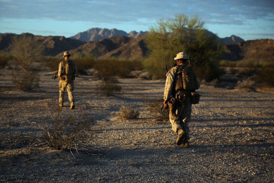 Marines assigned to Company E, 2nd Battalion, 7th Marine Regiment, 1st Marine Division, scan the area during a patrol as part of Talon Exercise 1-16 at Marine Corps Air Station, Yuma, Ariz., Oct. 14, 2015. The training took place at Baker’s Peak, a rugged desert training area located on the approximately 1,700,000 acre Barry M. Goldwater Range and was part of a larger event called Talon Exercise, which focused on offensive and defensive operations in desert and urban environments.