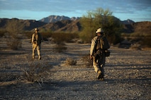 Marines assigned to Company E, 2nd Battalion, 7th Marine Regiment, 1st Marine Division, scan the area during a patrol as part of Talon Exercise 1-16 at Marine Corps Air Station, Yuma, Ariz., Oct. 14, 2015. The training took place at Baker’s Peak, a rugged desert training area located on the approximately 1,700,000 acre Barry M. Goldwater Range and was part of a larger event called Talon Exercise, which focused on offensive and defensive operations in desert and urban environments.