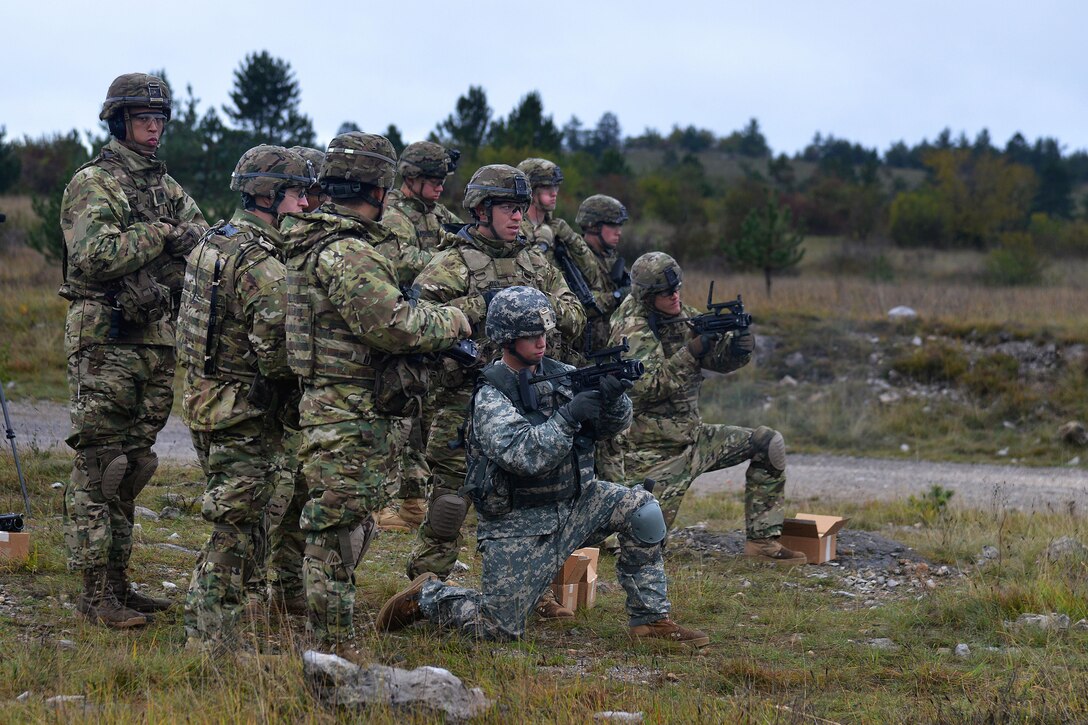 U.S. soldiers shoot targets with the M320 grenade launcher during exercise Rock Proof V at Bac Range, Postonja, Slovenia, Oct. 15, 2015. The paratrooper soldiers are assigned to Company C, 2nd Battalion, 503rd Infantry Regiment, 173rd Airborne Brigade, stationed in Vicenza, Italy. Exercise Rock Proof V is a training exercise between U.S. soldiers and the Slovenian armed forces, focusing on small-unit tactics and building interoperability between these allied forces. U.S. Army photo by Paolo Bovo