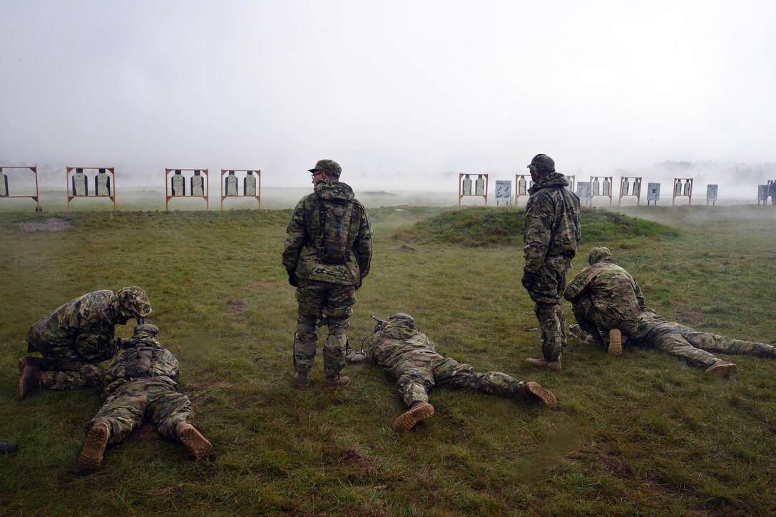 U.S. soldiers shoot targets with M240 machine gun during exercise Rock Proof V at Bac Range, Postonja, Slovenia, Oct. 15, 2015. The paratrooper soldiers are assigned to Company C, 2nd Battalion, 503rd Infantry Regiment, 173rd Airborne Brigade, stationed in Vicenza, Italy. Exercise Rock Proof V is a training exercise between U.S. soldiers and the Slovenian armed forces, focusing on small-unit tactics and building interoperability between these allied forces. U.S. Army photo by Paolo Bovo