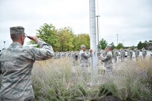 Col. Kevin Riley, 910th Mission Support Group commander, salutes while the flag is lowered during retreat. Retreat is a military ceremony signaled by a bugle call at the end of the duty day, providing troops a chance to pay respects to the U.S. flag. Riley officiated the retreat for the 910th Civil Engineer Squadron during the Unit Training Assembly, Oct. 3, 2015. (U.S. Air Force photo/Tech. Sgt. Rick Lisum)