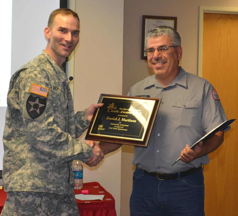 ALBQUERQUE, N.M. – District Commander Lt. Col. Patrick Dagon presents Daniel J. (Joe) Martinez with the Castle Award, Oct. 6, 2015.  