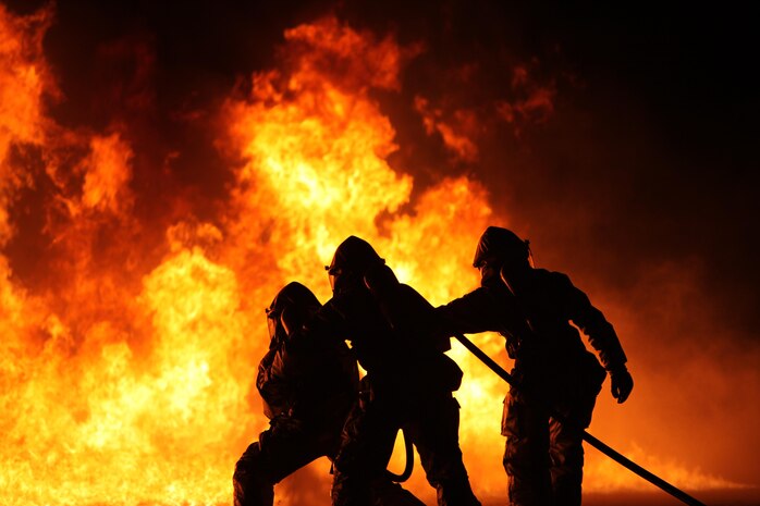 Aircraft Rescue and Firefighting Marines annihilate some of their first fuel fires at Marine Corps Air Station Cherry Point, N.C., Oct. 16, 2015. The training exercise taught the new Marines to battle the heat and keep pushing until they annihilate the flames, as well as get used to the environment of a real fire. (U.S. Marine Corps photo by Pfc. Nicholas P. Baird/ Released)