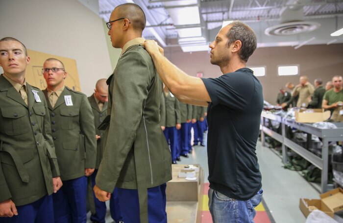 Recruits of Delta Company, 1st Recruit Training Battalion, get their uniforms tailored during their first uniform fitting at Marine Corps Recruit Depot San Diego, Oct. 14. This was the first time recruits got the chance to try on the uniforms. Today, all males recruited west of the Mississippi are trained at MCRD San Diego. The depot is responsible for training more than 16,000 recruits annually. Delta Company is scheduled to graduate Nov. 13.