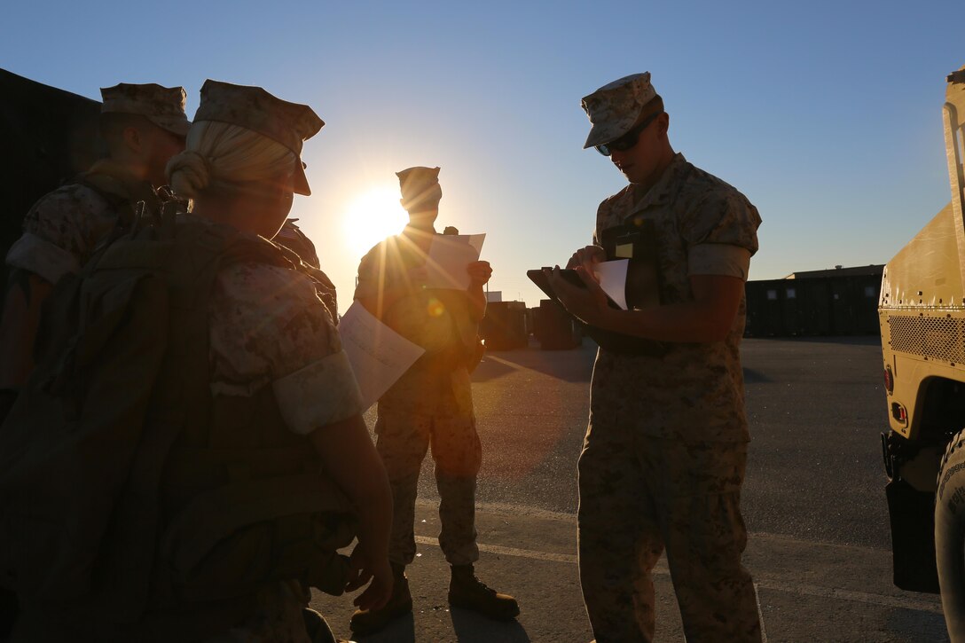 Marines receive their designated routes during an Incidental Humvee Licensing Course at Marine Corps Air Station Cherry Point, N.C., Oct. 15, 2015. Marine Wing Support Squadron 274 Marines underwent an extensive course that covered basic operational skills, vehicle capabilities, emergency procedures and first echelon mechanics. The Humvee has many versatile roles throughout the Marine Corps. Taking licensing courses to qualify Marines of different occupational fields helps expand their skill sets while allowing their unit to be more self-sufficient. 