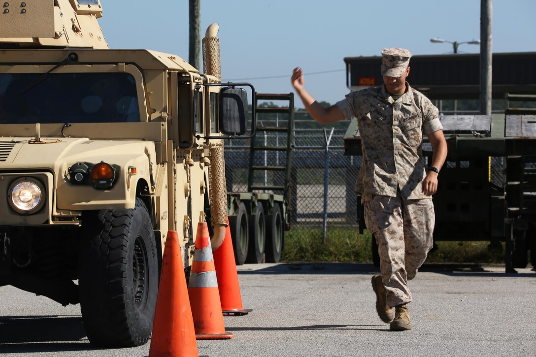 Lance Cpl. Patrick Donovan guides a Humvee during an Incidental Humvee Licensing Course at Marine Corps Air Station Cherry Point, N.C., Oct. 15, 2015. Marine Wing Support Squadron 274 Marines underwent an extensive course that covered basic operational skills, vehicle capabilities, emergency procedures and first echelon mechanics. The Humvee has many versatile roles throughout the Marine Corps. Taking licensing courses to qualify Marines of different occupational fields helps expand their skill sets while allowing their unit to be more self-sufficient. Donovan is a cyber-networks operator with the squadron. 