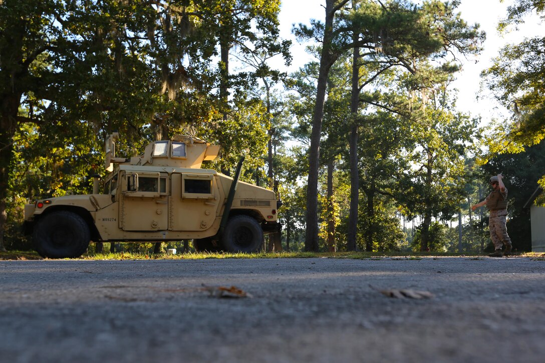 Cpl. Harry Garrett guides a Humvee during an Incidental Humvee Licensing Course at Marine Corps Air Station Cherry Point, N.C., Oct. 15, 2015. Marine Wing Support Squadron 274 Marines underwent an extensive course that covered basic operational skills, vehicle capabilities, emergency procedures and first echelon mechanics. The Humvee has many versatile roles throughout the Marine Corps. Taking licensing courses to qualify Marines of different occupational fields helps expand their skill sets while allowing their unit to be more self-sufficient. Garrett is the licensing noncommissioned officer the squadron. 