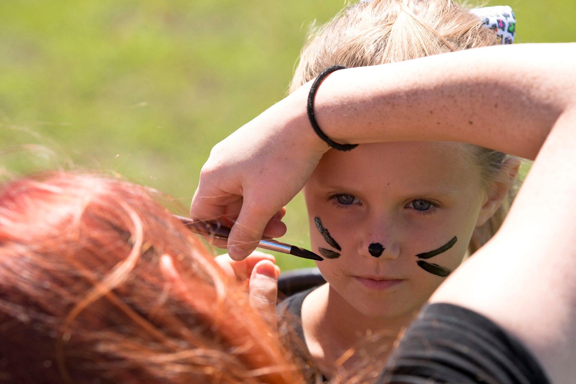 Margo Ables gets her face painted during the 913th Airlift Group’s “Family Day” celebration at Little Rock Air Force Base, Ark., Sept. 12, 2015. Margo is the daughter of Tech Sgt. Jeremy Ables, who is the Non-commissioned Officer in Charge of aircrew flight equipment assigned to the 327th Airlift Squadron at Little Rock AFB. (U.S. Air Force photo by Master. Sgt. Jeff Walston/Released) 
