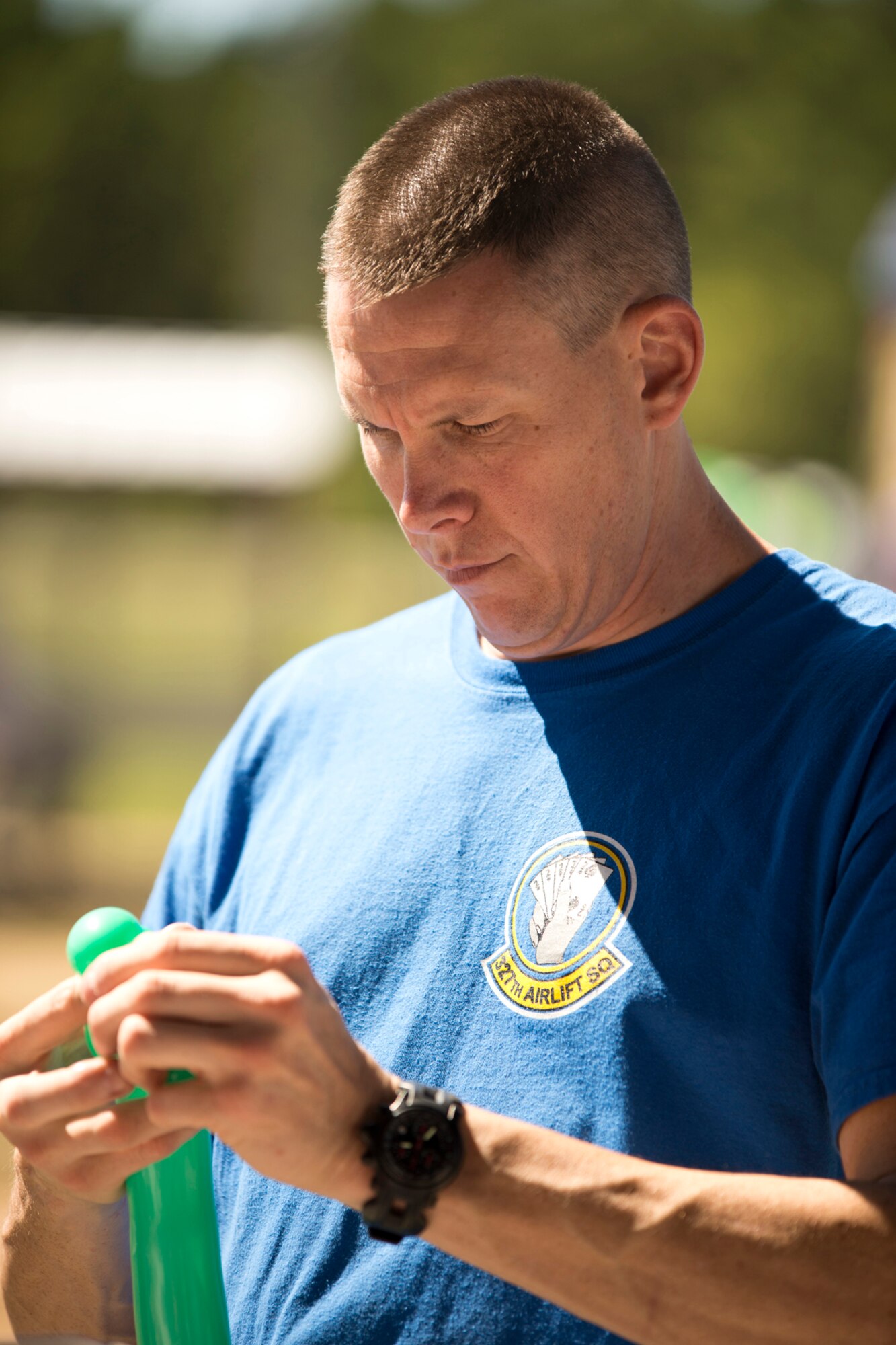 U.S. Air Force Maj. Scott Lawson, chief of safety, 913th Airlift Group, entertains children and adults alike with his balloon tying skills during the 913th Airlift Group’s “Family Day” celebration at Little Rock Air Force Base, Ark., Sept. 12, 2015. Approximately 1,000 Airmen and family members participated in the annual event, which promotes taking care of the unit’s family members. (U.S. Air Force photo by Master. Sgt. Jeff Walston/Released)  