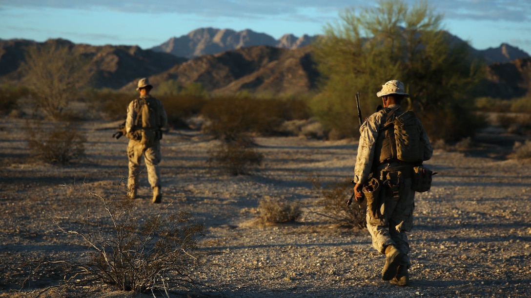 Marines assigned to Company E, 2nd Battalion, 7th Marine Regiment, 1st Marine Division, scan the area during a patrol as part of Talon Exercise 1-16 at Marine Corps Air Station, Yuma, Ariz., Oct. 14, 2015. The training took place at Baker’s Peak, a rugged desert training area located on the approximately 1,700,000 acre Barry M. Goldwater Range and was part of a larger event called Talon Exercise, which focused on offensive and defensive operations in desert and urban environments.