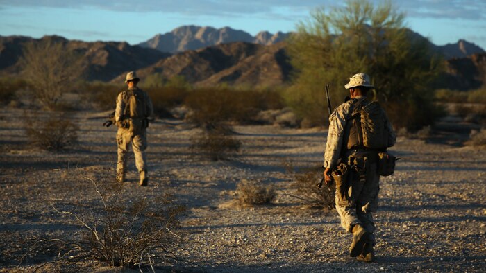 Marines assigned to Company E, 2nd Battalion, 7th Marine Regiment, 1st Marine Division, scan the area during a patrol as part of Talon Exercise 1-16 at Marine Corps Air Station, Yuma, Ariz., Oct. 14, 2015. The training took place at Baker’s Peak, a rugged desert training area located on the approximately 1,700,000 acre Barry M. Goldwater Range and was part of a larger event called Talon Exercise, which focused on offensive and defensive operations in desert and urban environments.
