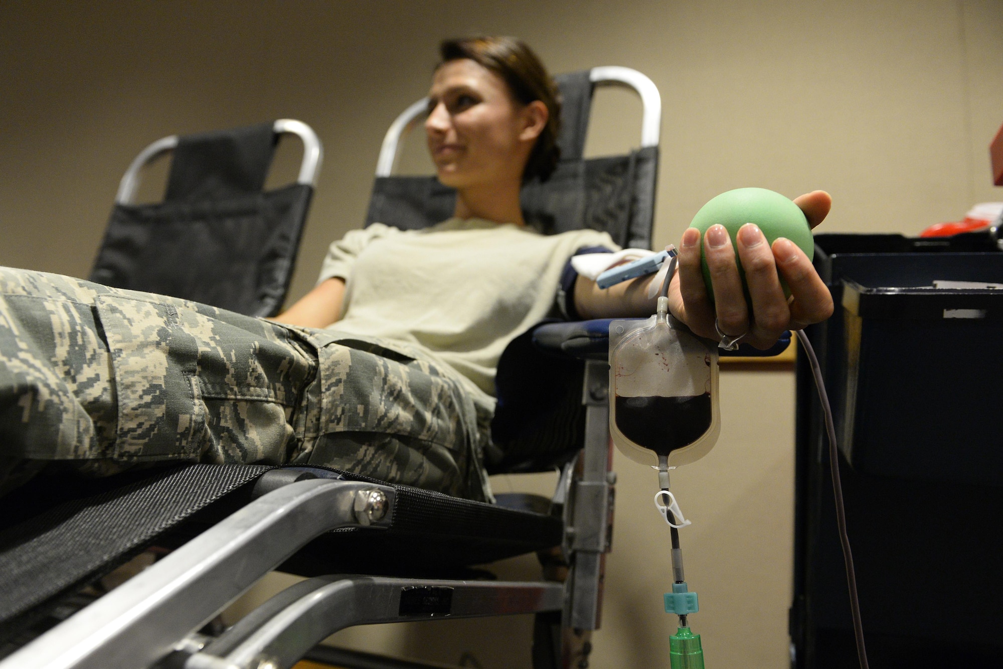First Lt. Fanita Schmidt, a 4th Space Operations Squadron orbital analysis engineer, donates blood at the 3rd annual blood drive hosted by the 21st Medical Dental Squadron at Schriever Air Force Base, Colo., Oct. 6, 2015. Schmidt explained her decision to donate was based on personal experiences from her childhood, when she received a blood transfusion after a devastating car wreck. (U.S. Air Force photo/Christopher DeWitt)
