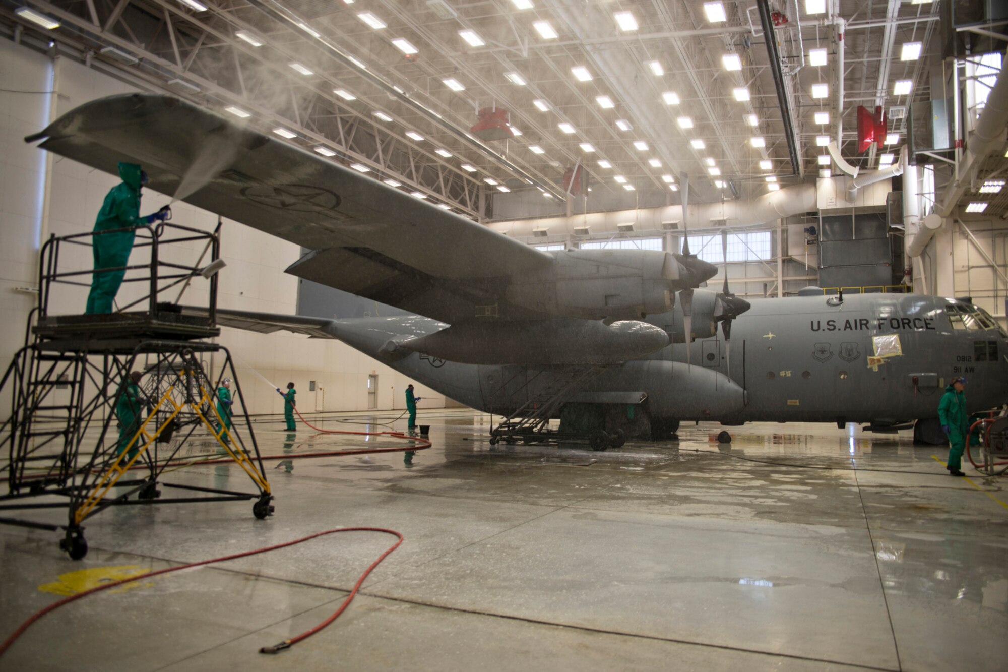 Airmen from the 913th Maintenance Squadron and 50th Airlift Squadron wash a C-130H1 Hercules at Little Rock Air Force Base, Ark., Sept. 14, 2015. The Airmen are preparing the aircraft for what may be its final flight to Davis-Monthan Air Force Base, Ariz., where it will be stored in the “Boneyard.” (U.S. Air Force photo by Master Sgt. Jeff Walston/Released) 
