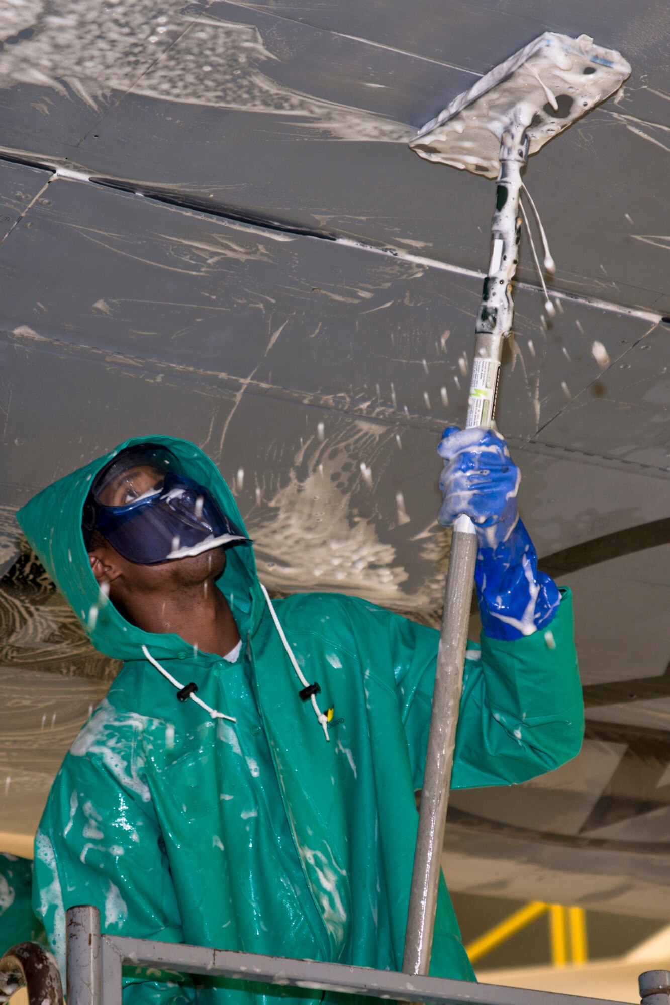 U.S. Air Force Senior Airman John May, a crew chief assigned to the 913th Maintenance Squadron, scrubs down the wing of a C-130H1 Hercules in a hangar at Little Rock Air Force Base, Ark., Sept. 14, 2015. May is assisting other Airmen in preparing the aircraft for what may be its final flight when it transits to Davis-Monthan Air Force Base, Ariz., to be stored in the “Boneyard” for future use. (U.S. Air Force photo by Master Sgt. Jeff Walston/Released) 