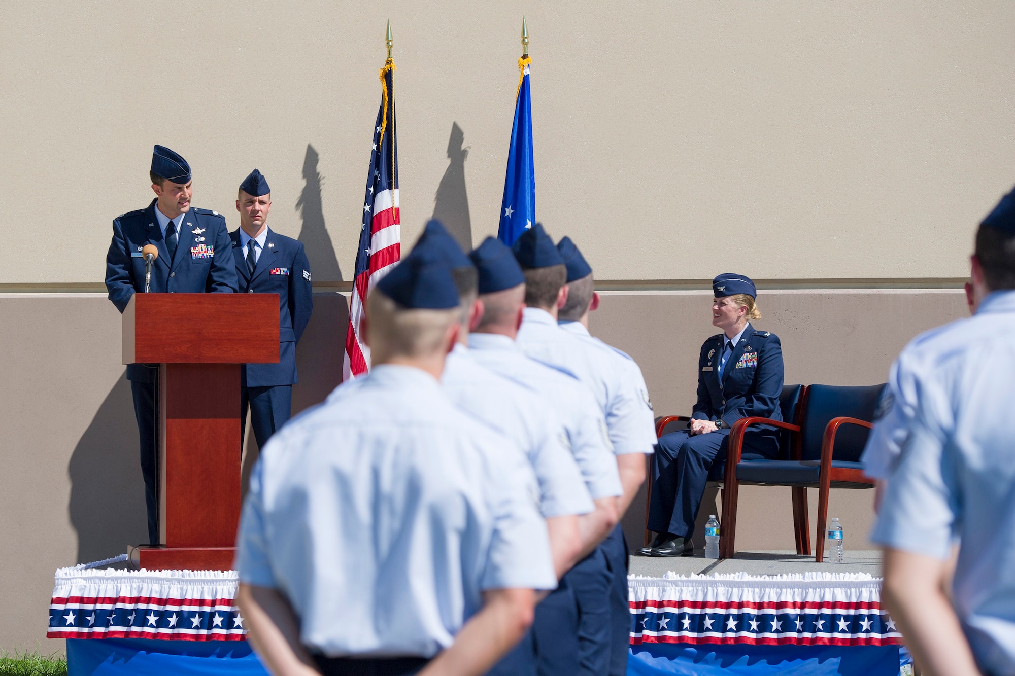 Col. Jennifer P. Sovada (right), the Air Force Technical Applications Center commander, looks on as Lt. Col. Ehren Carl delivers his first remarks after assuming command of AFTAC’s Technical Surveillance Squadron at Patrick AFB, Fla., Oct. 15, 2015. Carl is the first officer to assume command of one of five newly-formed squadrons at AFTAC. (U.S. Air Force photo/Matthew Jurgens)