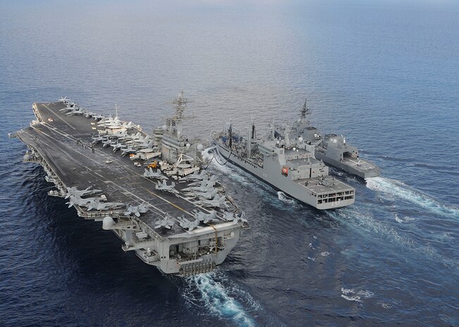 INDIAN OCEAN (Oct. 18, 2015) The aircraft carrier USS Theodore Roosevelt (CVN 71) and Japanese Maritime Self-defense Force Akizuki-class destroyer JS Fuyuzuki (DD-118) sail alongside the Indian Deepak-class fleet tanker INS Shakti (A 57) during a replenishment-at-sea exercise as a part of Exercise Malabar 2015. Malabar is a continuing series of complex, high-end war fighting exercises conducted to advance multi-national maritime relationships and mutual security. The aircraft carrier USS Theodore Roosevelt (CVN 71) is operating in the U.S. 7th Fleet area of operations as part of a worldwide deployment en route to its new homeport in San Diego to complete a three-carrier homeport shift. 