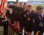 Team USA members salute the colors after being awarded gold for formation skydiving at the CISM World Games in South Korea, Oct. 8, 2015. From front to back are: Sgts. 1st Class Jennifer Davidson, Laura Davis, Scott Janice, Angela Nichols and Dannielle Woosley.