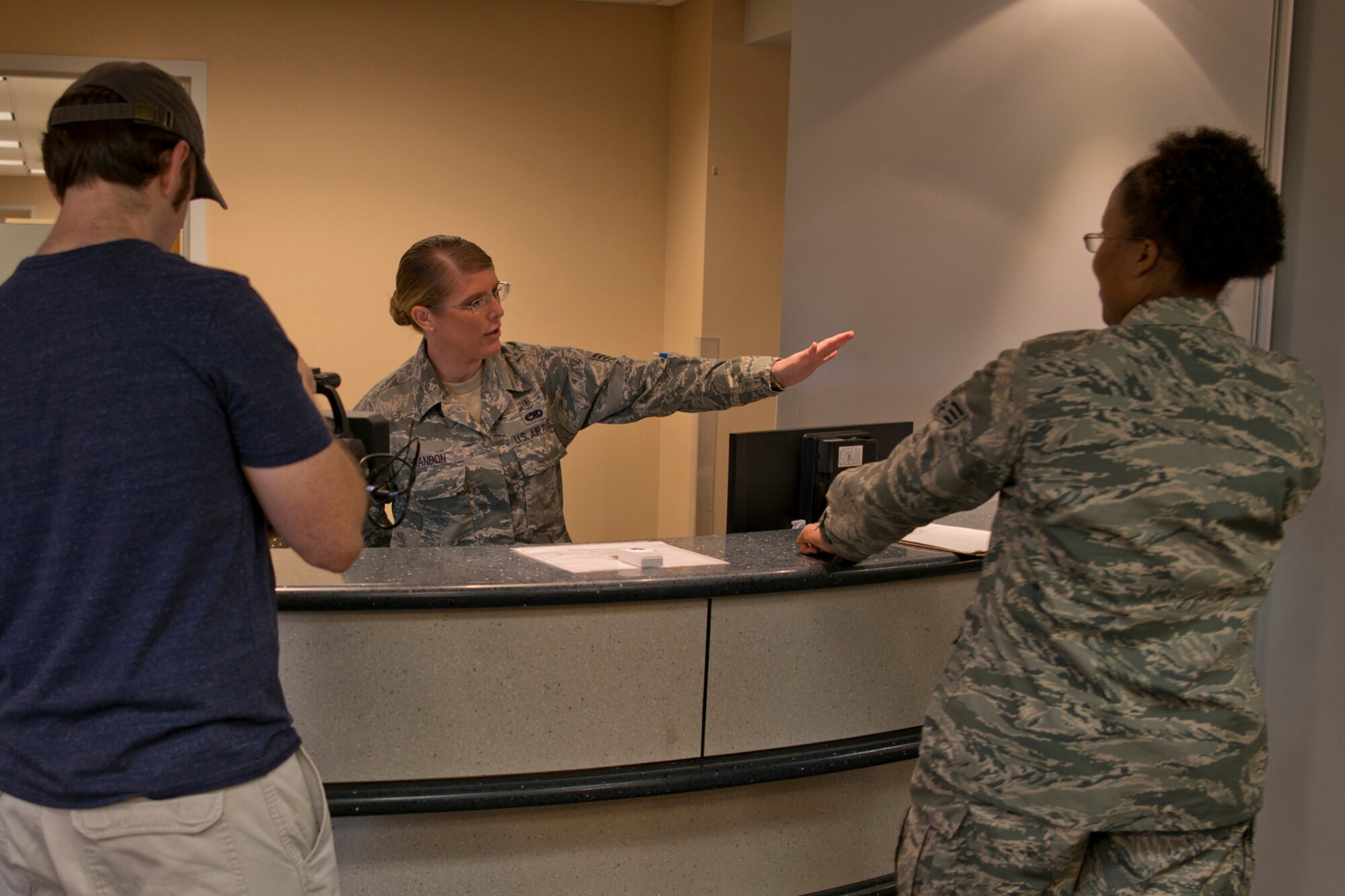U.S. Air Force Senior Airmen Bridget Brandon, health service management, and Shannae Morgan, a medical laboratory technician, assigned to the 913th Aerospace Medical Squadron, perform for the cameras during the October Unit Training Assembly at Little Rock Air Force Base, Ark., Oct. 3, 0215. A photography/video team were on base to record B-roll, interviews and photographs for use by the Air Force Reserve Command in promotional and recruiting advertising. (U.S. Air Force photo by Master Sgt. Jeff Walston/Released)