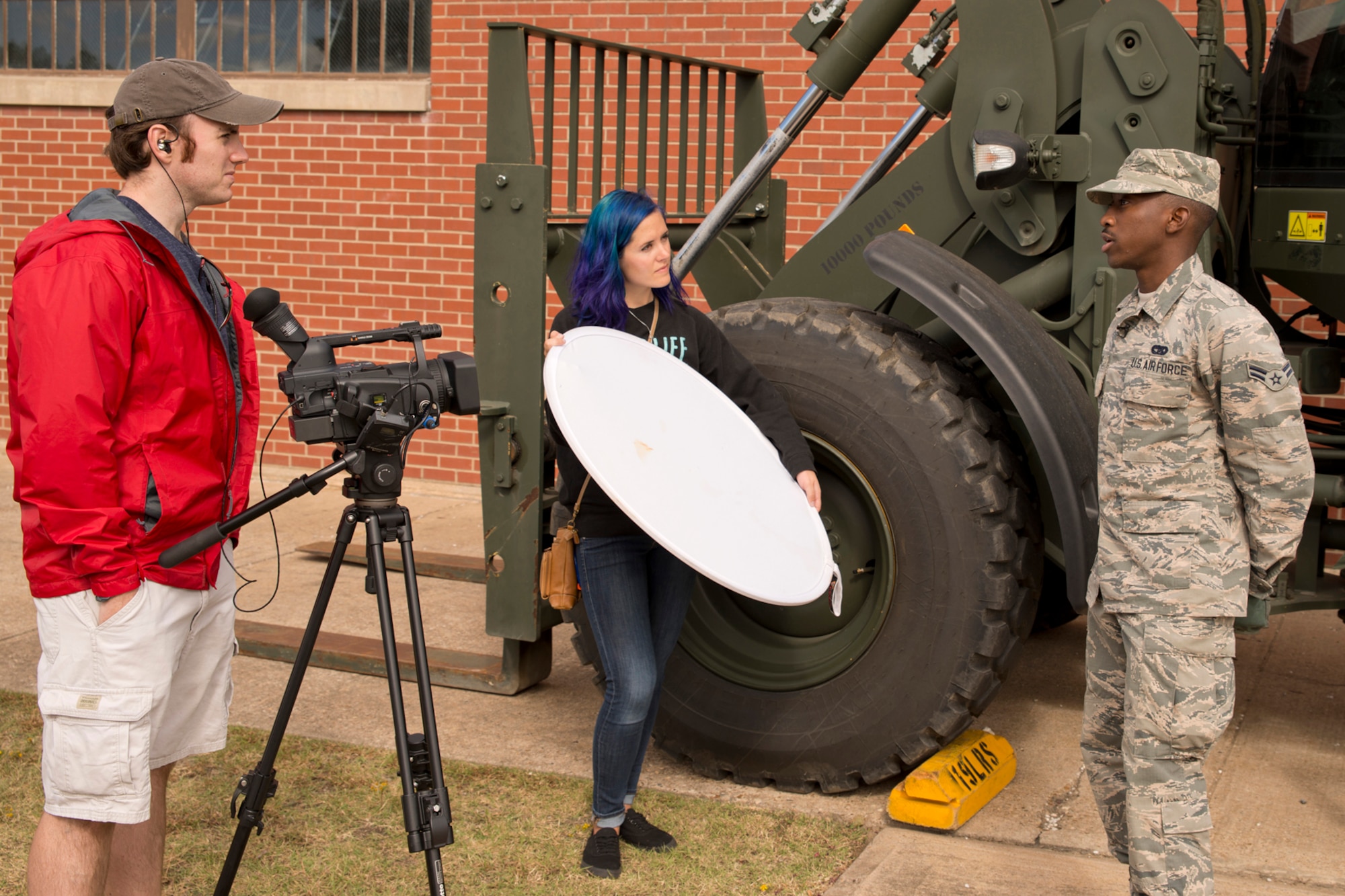 U.S. Air Force Airman 1st Class Eddie Higgins, air transportation, 96th Aerial Port Squadron, is interviewed by videographer Will Halley during the October Unit Training Assembly at Little Rock Air Force Base, Ark., Oct. 3, 0215. Halley was part of a photography/video team on base to record B-roll, interviews and photographs the Air Force Reserve Command will be using in future promotional and recruiting purposes. (U.S. Air Force photo by Master Sgt. Jeff Walston/Released)