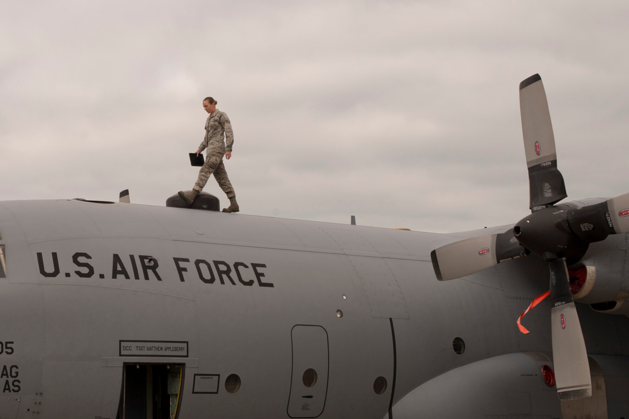 U.S. Air Force Senior Airman Jennifer Franke, a crew chief assigned to 913th Maintenance Squadron, conducts a post flight inspection of a C-130 H Hercules for the cameras during the October Unit Training Assembly at Little Rock Air Force Base, Ark., Oct. 3, 0215. Franke was one of many subject matter experts photographed while doing their jobs for future use by the Air Force Reserve Command in promotional and recruiting advertising. (U.S. Air Force photo by Master Sgt. Jeff Walston/Released)