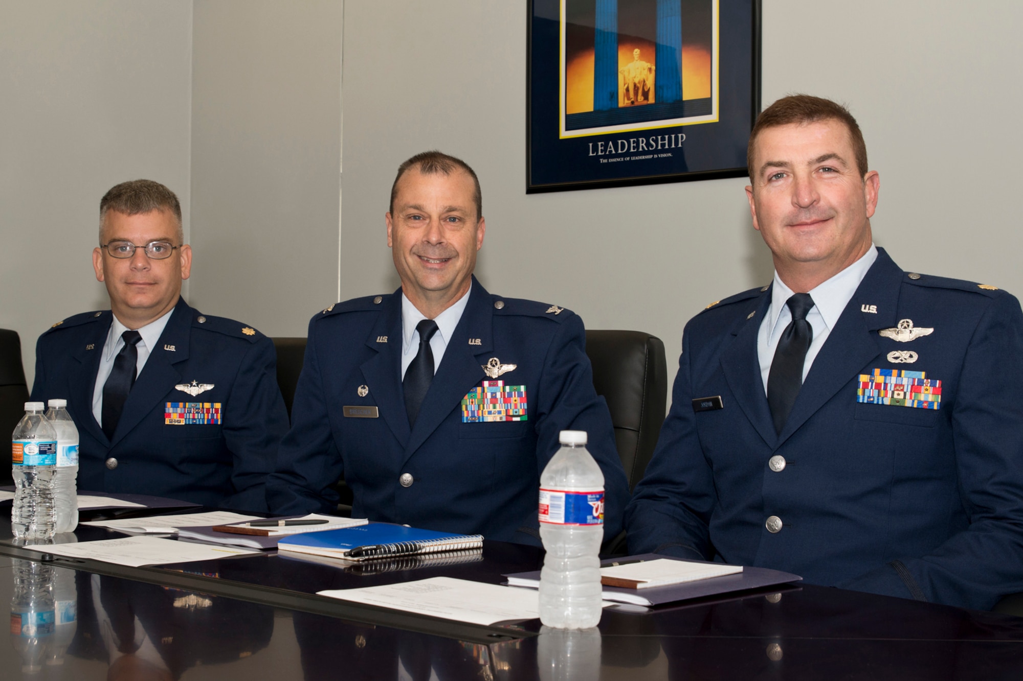 U.S. Air Force Maj. Rob Hammontree, instructor navigator, Col. Craig Drescher, commander, 913 AG, and Maj. Eric Jordan, deputy chief of stan/eval, 327th Airlift Squadron, pose for a photo before convening a Deserving Airman board at Little Rock Air Force Base, Ark., Oct. 4, 2015. The Deserving Airman Commissioning Program is an example of the Air Force commitment to grow from within, recognizing exemplary enlisted members and commissioning them to be future leaders. (U.S. Air Force photo by Master Sgt. Jeff Walston/Released)