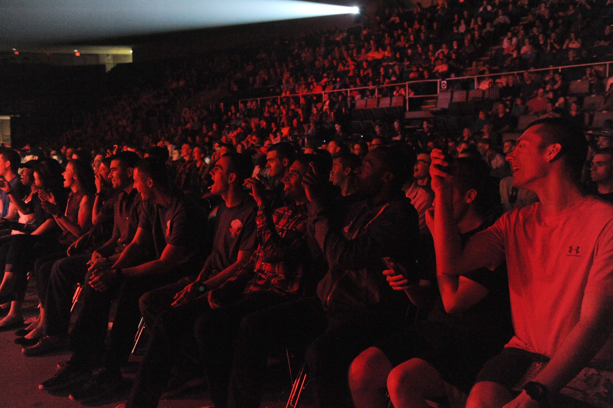 Hundreds of Keesler Airmen, families and community members watch the Tops in Blue perform during their 2015 World Tour at the Mississippi Coast Coliseum, Oct. 17, 2015, Biloxi, Miss. This year’s tour takes the group to 20 countries with more than 75 performances. For more information on the team or audition requirements, visit www.topsinblue.com. (U.S. Air Force photo by Kemberly Groue)
