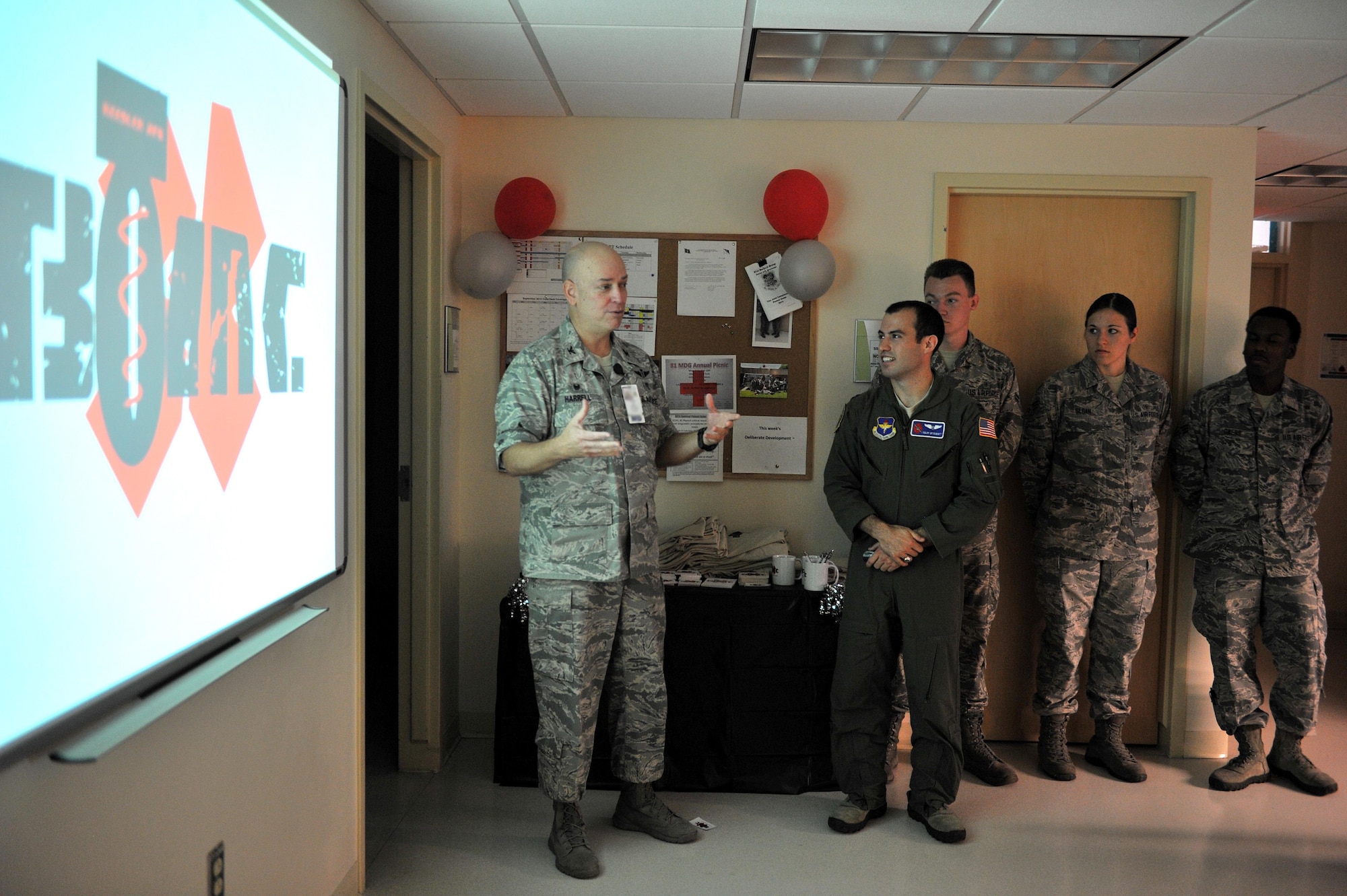 Col. (Dr.) Thomas Harrell, 81st Medical Group commander, gives remarks during the Base Operation Medicine Cell grand opening at the Keesler Medical Center, Sept. 28, 2015, Keesler Air Force Base, Miss. The Keesler BOMC is working to standardize Air Force healthcare by standardizing Public Health Assessments, Deployment Health Assessments, flight physicals and clearance physicals in order to make direct patient care more accessible, personal and timely. This clinic is the first of its kind in the Air Force. (U.S. Air Force photo by Airman 1st Class Duncan McElroy)