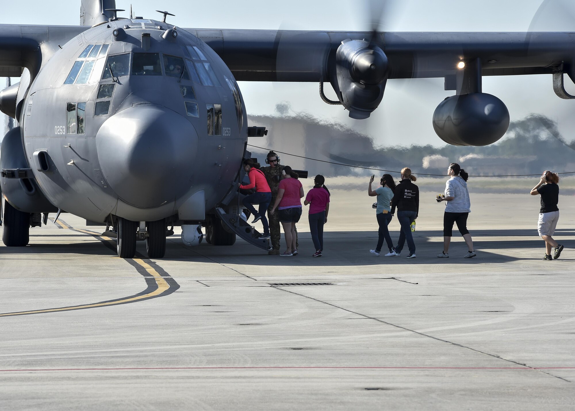 Spouses board an AC-130U Spooky during spouse flight day at Hurlburt Field, Fla., Oct. 17, 2015. Military spouses had an opportunity to fly in an MC-130H Combat Talon II, AC-130U Spooky, CV-22B Osprey or PC-12 aircraft. (U.S. Air Force photo by Senior Airman Jeff Parkinson)