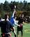 Nicolas Sisco, 90th Missile Maintenance Squadron Electrical Maintenance Team technician, runs past defensemen from Fort Carson, Colo., during a flag football game Oct. 17, 2015, at the U.S. Air Force Academy, Colo. The Warren team came in second in the tournament, falling to the undefeated team from Fort Carson, Colo. (U.S. Air Force photo by Senior Airman Brandon Valle)