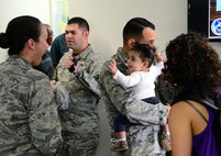 Airmen and their families gather at a reception for the new Airman and Family Readiness Center Oct. 16, 2015, at Malmstrom Air Force Base, Mont. The A&FRC focuses on offering programs to improve life for both Airmen and their dependents. (U.S. Air Force photo/Airman 1st Class Magen M. Reeves)