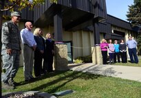 Wing leadership and staff celebrate the ribbon cutting of the new Airman and Family Readiness Center Oct. 16, 2015, at Malmstrom Air Force Base, Mont. The A&FRC is run by a ten-member staff of mostly civilians who service not only base personnel, but the entire state of Montana’s military affairs members. (U.S. Air Force photo/Airman 1st Class Magen M. Reeves)