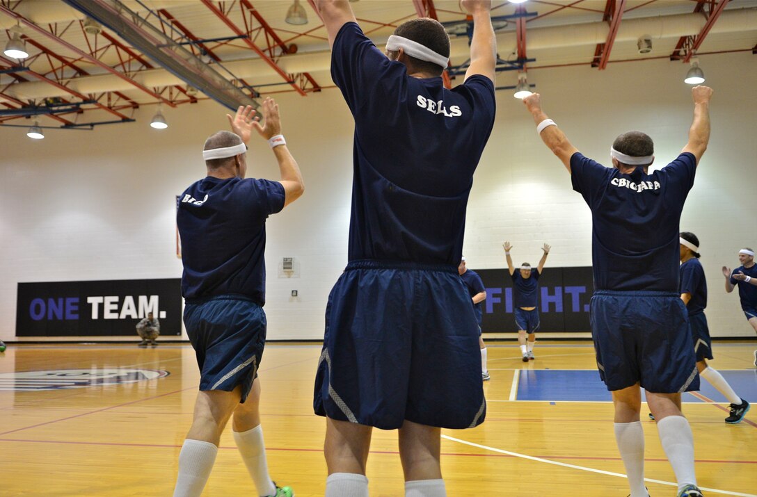 Members of the Whiteman Chiefs’ group celebrate after a dodgeball victory against the “Eagles” during Wingman Day, Oct. 9, 2015 at Whiteman Air Force Base, Mo. The wing held activities that emphasized mental, physical, social and spiritual fitness. The “Eagles” displayed resilience and came back to win the series against the Chiefs. (U.S. Air Force photo by Tech. Sgt. Miguel Lara III/Released)