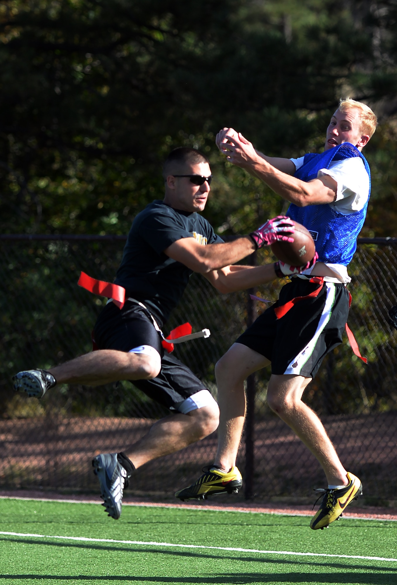 Nicolas Sisco, 90th Missile Maintenance Squadron Electro-Mechanical Team technician, intercepts a pass intended for a receiver from the U.S. Air Force Academy, Colo., Oct. 17, 2015, during a flag football game at the Air Force Academy. Warren won the game to move on to the championship. (U.S. Air Force photo by Senior Airman Brandon Valle)