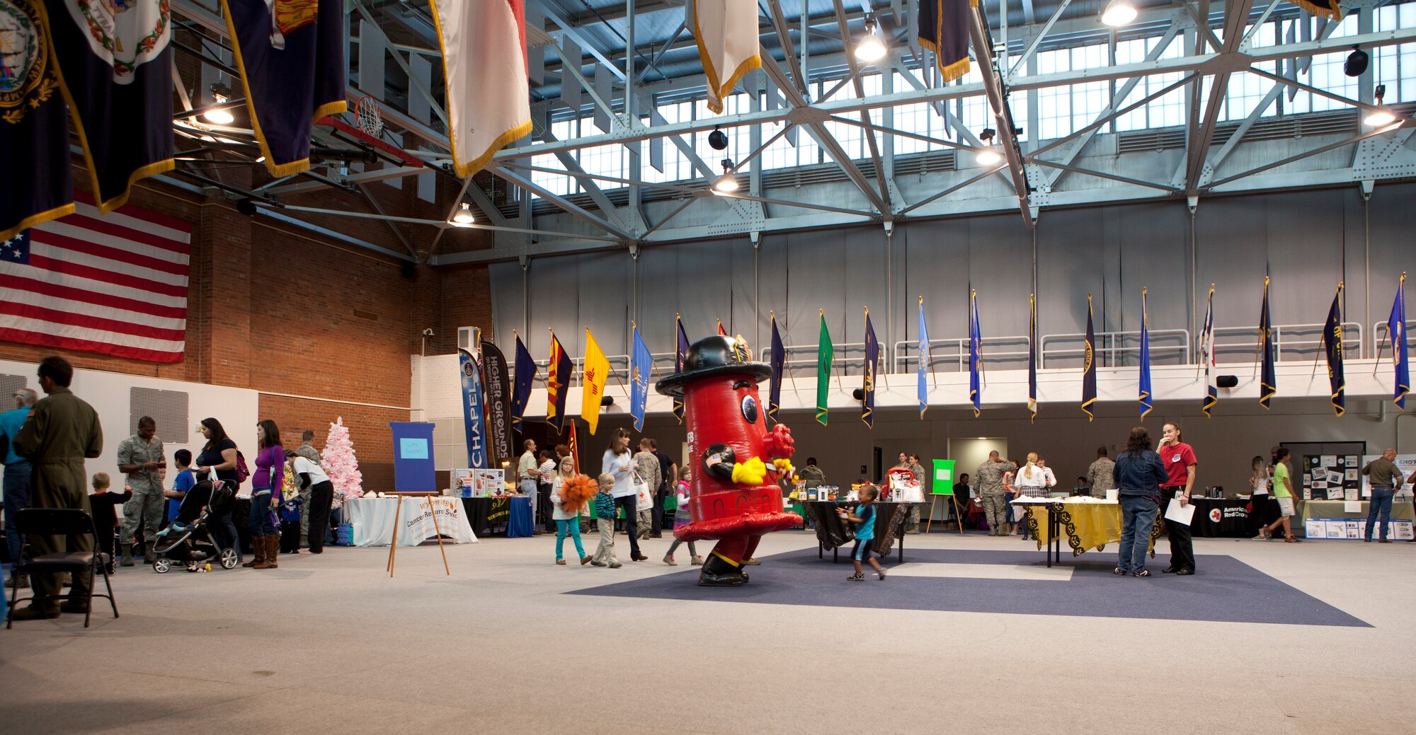The F.E. Warren Air Force Base community gathers for the 90th Medical Group’s Health Fair, Oct. 16, 2015, in the Fall Hall Community Center. Various booths were available for visitors to interact with and gain more information; booths provided information on the Medical Group’s services, safety tips and local agencies. (U.S. Air Force photo by Lan Kim)