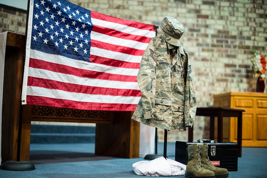 A memorial display for U.S. Air Force Tech. Sgt. Marissa Hartford rests at the alter during her memorial ceremony at the base chapel Oct. 16, 2015, at Moody Air Force Base, Ga. Hartford was assigned to Moody nine years and deployed once to Djibouti, Africa. (U.S. Air Force Senior Airman Ceaira Tinsley/Released)