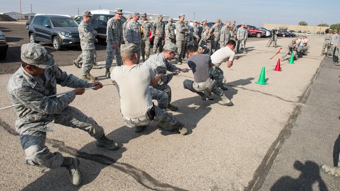 Team Martinez (left) and Team Gibson compete in a tug-of-war battle for a tie-breaking shot at first place in the 3rd annual CE Readiness Challenge Oct. 15, 2015 at Mountain Home Air Force Base, Idaho. Each team won points based on performance on completion of 10 challenges set-up across the base. (U.S. Air Force photo by Airman 1st Class Connor J. Marth)