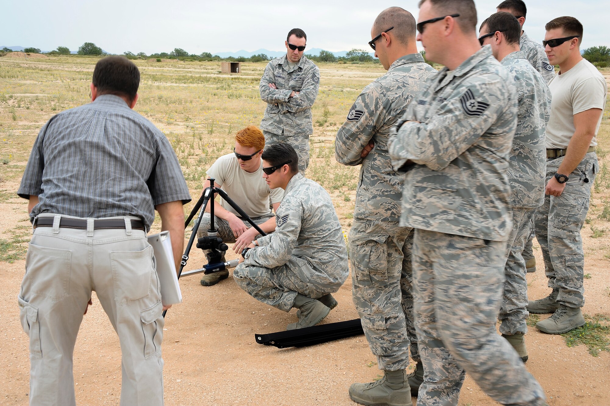 U.S. Air Force Senior Airman Joseph Gleason, 27th Special Operations Civil Engineer Squadron explosive ordnance disposal technician, and Staff Sgt. Joseph Mann, 355th Civil Engineer Squadron EOD technician, set up a portable X-ray generator during advanced X-ray training at Davis-Monthan Air Force Base, Ariz., Oct. 15, 2015. EOD technicians from D-M AFB, Luke AFB, Ariz., Edwards AFB, Calif., Cannon AFB, N.M. and Naval Air Station Joint Reserve Base Fort Worth, Texas, attended the training. (U.S. Air Force photo by Airman 1st Class Mya M. Crosby/Released)