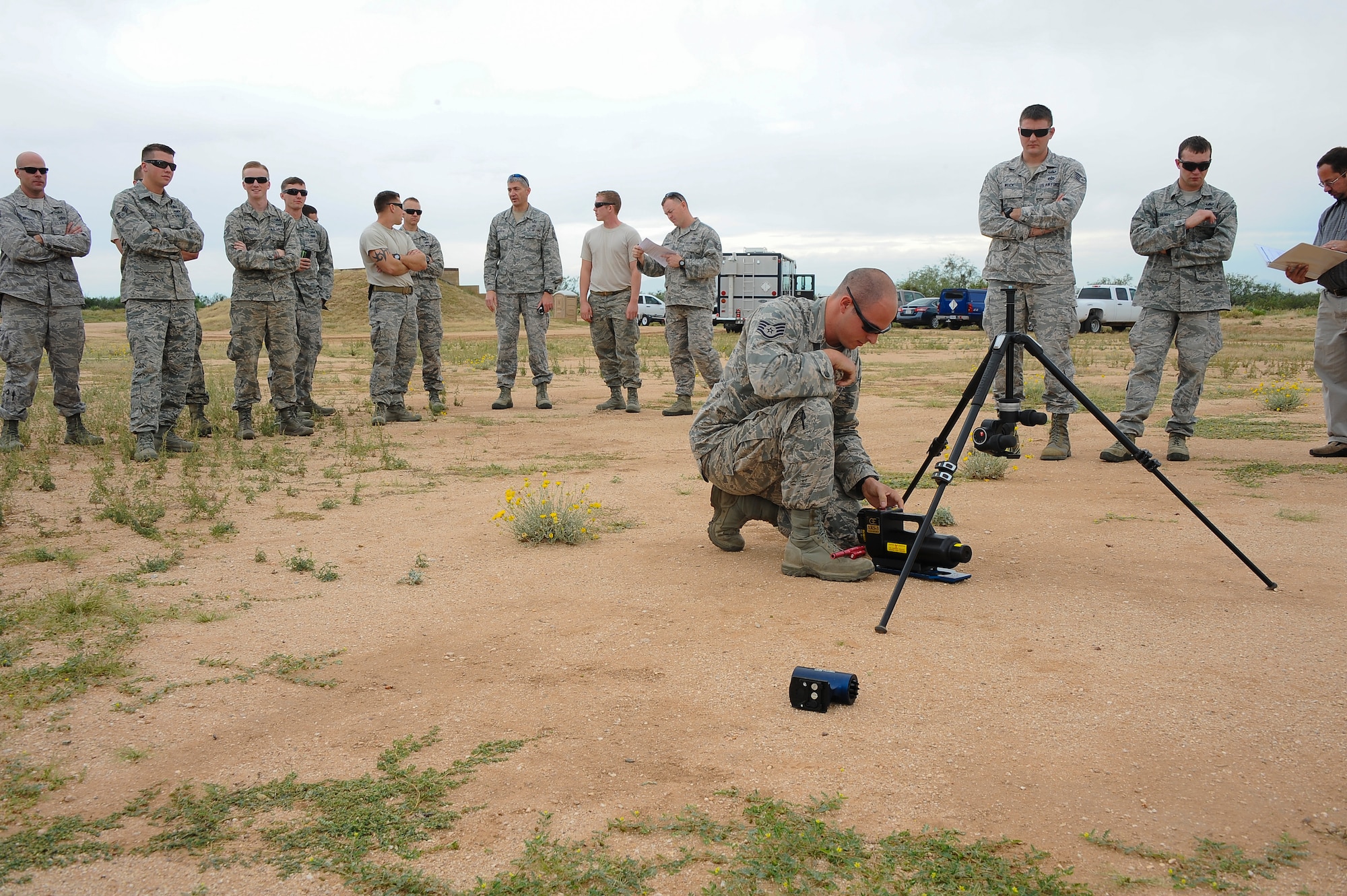 U.S. Air Force Staff Sgt. Patrick Barbarino, 355th Civil Engineer Squadron explosive ordnance disposal technician, reattaches an X-ray generator to a tripod during advanced X-ray training at Davis-Monthan Air Force Base, Ariz., Oct. 15, 2015. EOD technicians from D-M AFB, Luke AFB, Ariz., Edwards AFB, Calif., Cannon AFB, N.M. and Naval Air Station Joint Reserve Base Fort Worth, Texas, attended the training. (U.S. Air Force photo by Airman 1st Class Mya M. Crosby/Released)